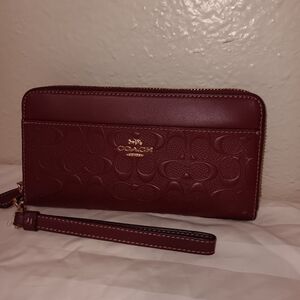 Coach wristlet large burgundy/maroon  color